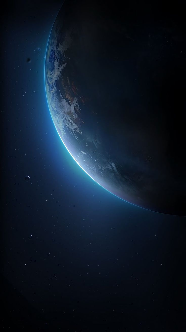 The blue-lit edge of Earth seen from space